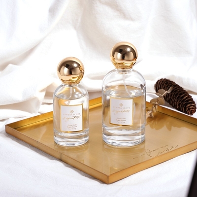 Chai nước hoa sang trọng bằng thủy tinh tròn rỗng OEM Zamac Gold 50ML 100ML